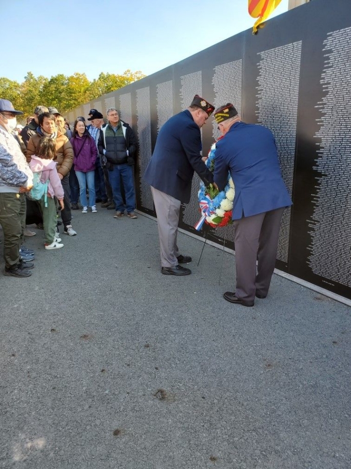 SVC Nate Smith and District Commander Greg Protsko placing a wreath at the moving wall